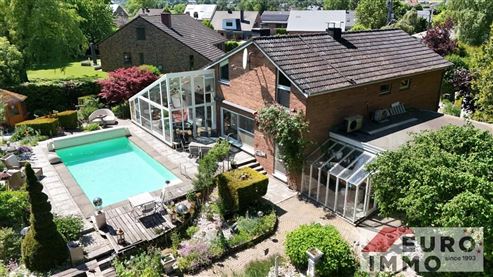 Ein elegantes Zuhause mit Seele und Charakter:  EFH-Juwel mit Pool, Wintergarten und Wohlfühlgarten in naturnaher Lage mit perfekter Anbindung