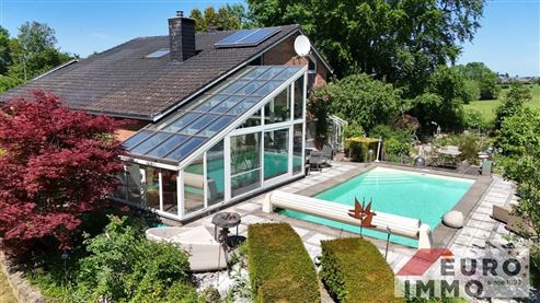 Ein elegantes Zuhause mit Seele und Charakter:  EFH-Juwel mit Pool, Wintergarten und Wohlfühlgarten in naturnaher Lage mit perfekter Anbindung