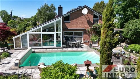 Ein elegantes Zuhause mit Seele und Charakter:  EFH-Juwel mit Pool, Wintergarten und Wohlfühlgarten in naturnaher Lage mit perfekter Anbindung