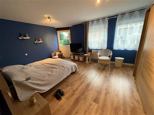 Im Herzen von Eupen – zeitgemäße und elegante Stadtwohnung mit großer Terrasse, Parkblick, Tiefgaragenstellplatz und Keller!