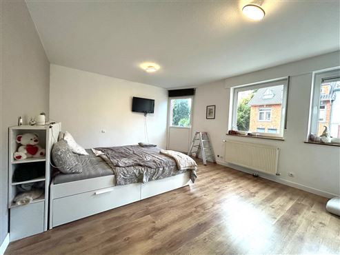 Im Herzen von Eupen – zeitgemäße und elegante Stadtwohnung mit großer Terrasse, Parkblick, Tiefgaragenstellplatz und Keller!