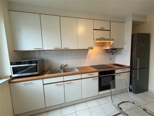 Angenehmes Wohnen im Grünen in hervorragender Lage in Etterbeek – Großzügige Wohnung mit Balkon, privatem Gemeinschaftsgarten, Tiefgaragenstellplatz und Keller